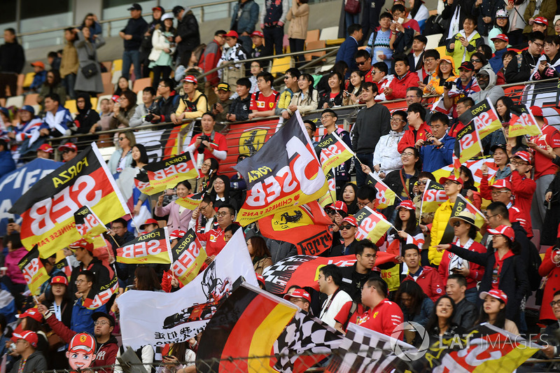 Sebastian Vettel, Ferrari fans and flags