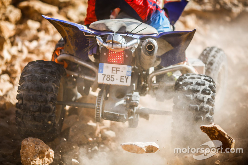 Acción de Quad