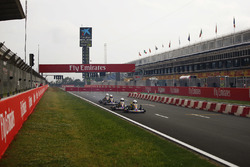 A race is held for junior karters on the pit straight