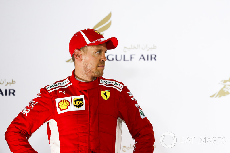 Sebastian Vettel, Ferrari, 1° classificato, sul podio