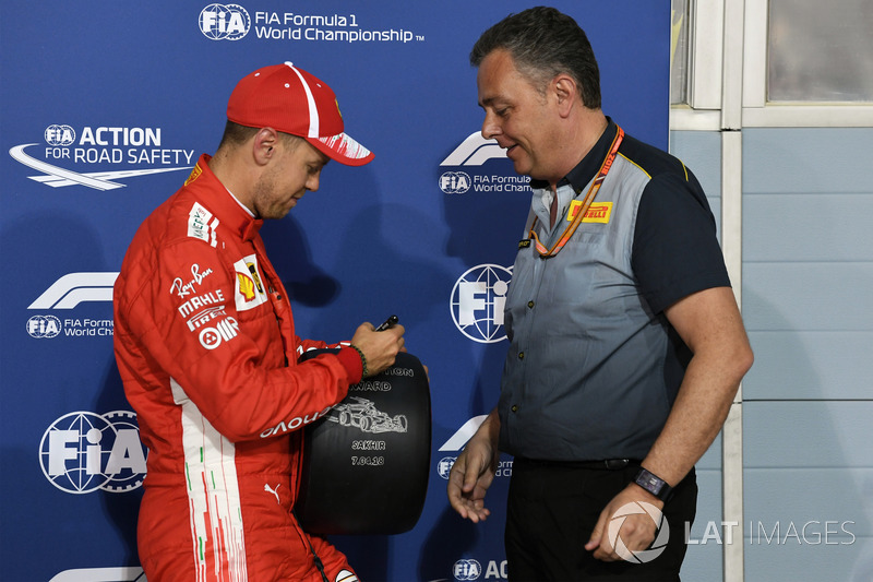 Sebastian Vettel, Ferrari receives the Pirelli Pole Position award from Mario Isola, Pirelli Sportin