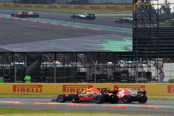 Max Verstappen, Red Bull Racing RB13 and Sebastian Vettel, Ferrari SF70H battle at the start of the race