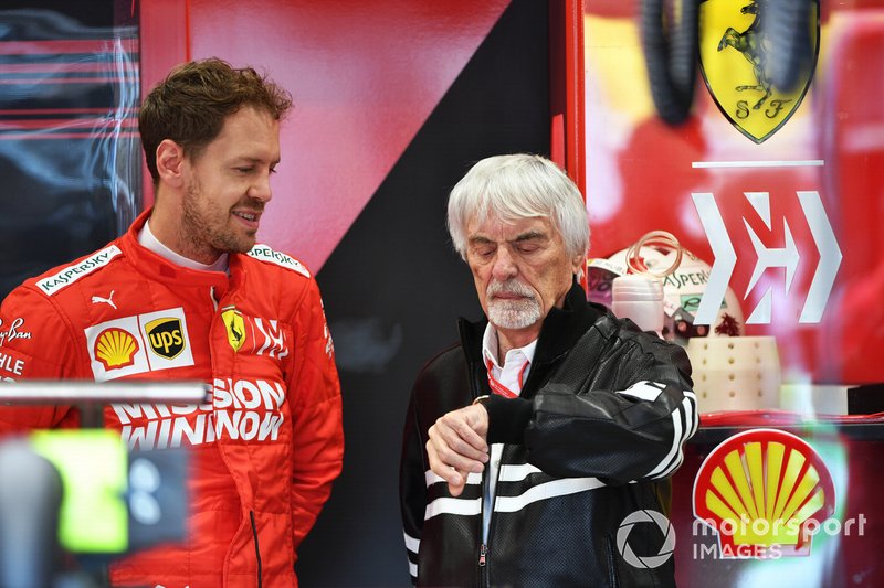 Bernie Ecclestone, Chairman Emiritus of Formula 1, in the Ferrari garage with Sebastian Vettel, Ferrari