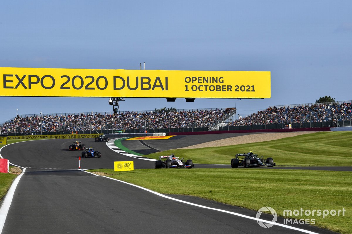 Sebastian Vettel, Aston Martin AMR21, Nikita Mazepin, Haas VF-21, and Esteban Ocon, Alpine A521