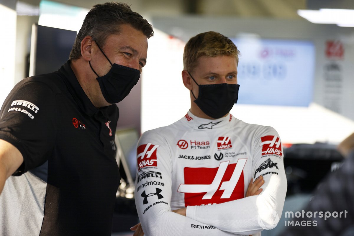 Mick Schumacher in the Haas garage with an engineer.