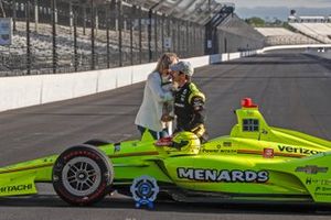 Simon Pagenaud, Team Penske Chevrolet, girlfriend Hailey McDermott and dog Norman pose for front row photos