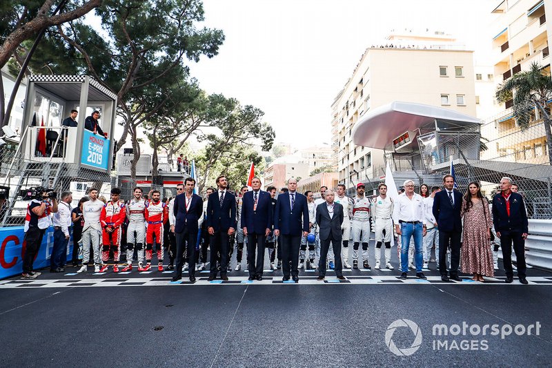 Drivers line up on the start line for the Monegasque national anthem