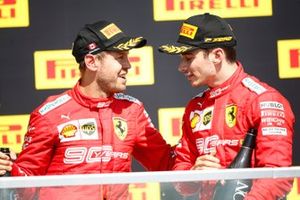 Sebastian Vettel, Ferrari, seconda posizione, e Charles Leclerc, Ferrari, terza posizione, sul podio