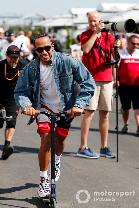 Lewis Hamilton, Mercedes AMG F1 on a scooter in the paddock