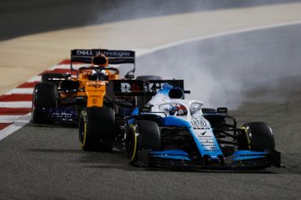 George Russell, Williams Racing FW42, leads Carlos Sainz Jr., McLaren MCL34