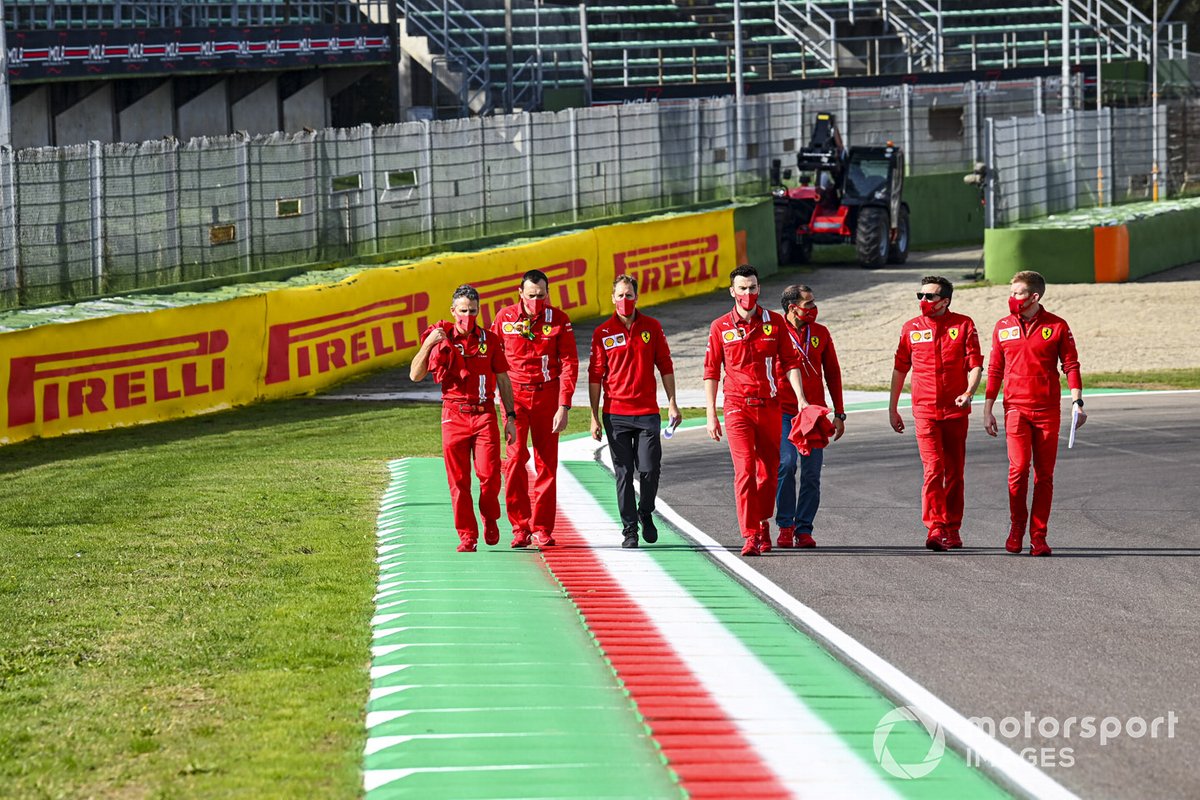 Sebastian Vettel, Ferrari, walks the track with Marc Gene, reserve driver, Ferrari and other team mates