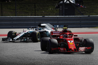 Kimi Raikkonen, Ferrari SF71H, leads Lewis Hamilton, Mercedes AMG F1 W09 EQ Power+