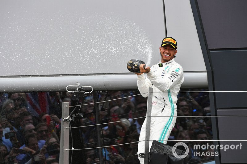 Lewis Hamilton, Mercedes AMG F1, 1st position, sprays Champagne from the podium