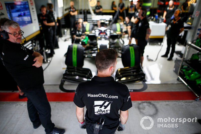 Haas F1 mechanics at work in the garage