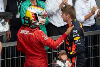 Sebastian Vettel, Ferrari, 2nd position, congratulates Max Verstappen, Red Bull Racing, 1st position, in Parc Ferme