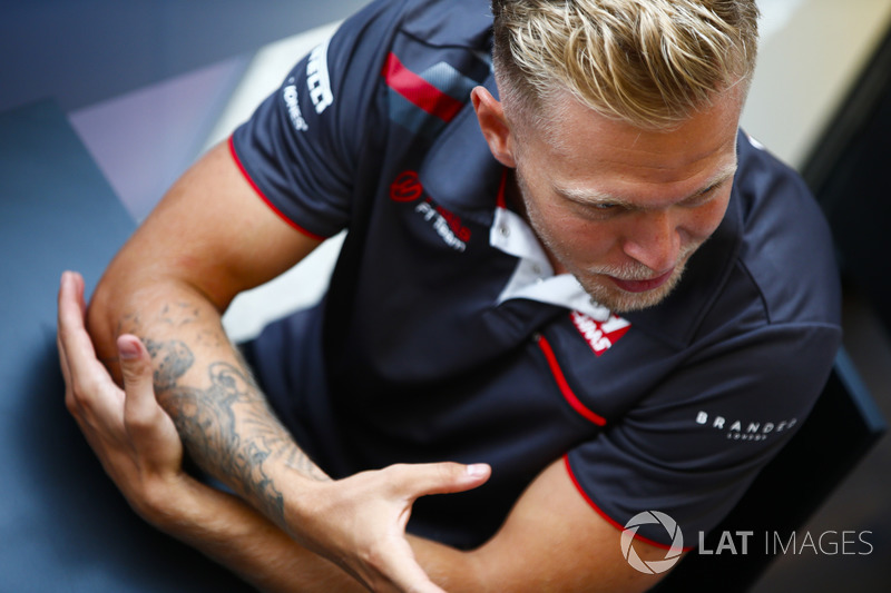 Kevin Magnussen, Haas F1 Team, talks to the media