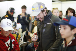 Fernando Alonso, McLaren, meets the grid kids