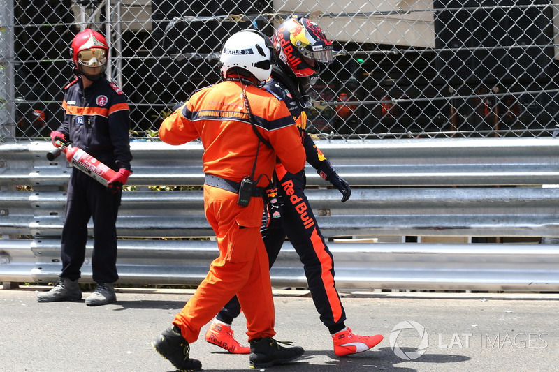 Max Verstappen, Red Bull Racing walks away with a marshal after crashing