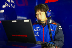 A Toro Rosso Honda engineer at work on a laptop