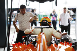 Fernando Alonso, McLaren, enters his cockpit