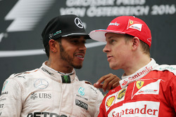 (L to R): Race winner with Lewis Hamilton, Mercedes AMG F1 on the podium