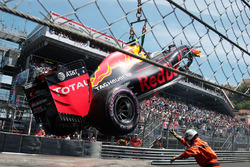 The Red Bull Racing RB12 of Max Verstappen, Red Bull Racing, who crashed out of qualifying, is craned away