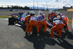 Marshals recover the car of race retiree Carlos Sainz Jr., Scuderia Toro Rosso STR12