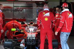 Sebastian Vettel, Ferrari looks at Ferrari SF70H with cockpit shield