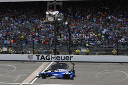 Takuma Sato, Andretti Autosport Honda crosses the finish line and the yard of bricks under the check