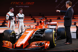 Race drivers Stoffel Vandoorne and Fernando Alonso on stage with presenter Simon Lazenby at the launch of the McLaren MCL32