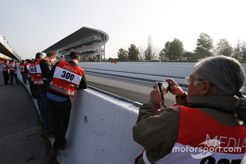 Media gather at the pit lane exit