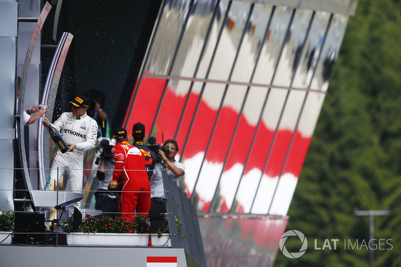 Winner Valtteri Bottas, Mercedes AMG F1, sprays champagne on the podium, Sebastian Vettel, Ferrari, 