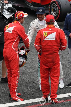 Sebastian Vettel, Ferrari, Lewis Hamilton, Mercedes AMG F1 and Kimi Raikkonen, Ferrari celebrate in