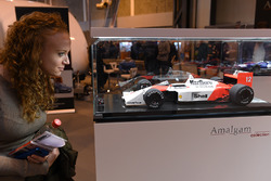 A fan examines an Amalgam 1988 McLaren MP4/4 Honda model