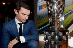 2016 Indy 500 winner Alexander Rossi looks at his face on the Borg-Warner trophy