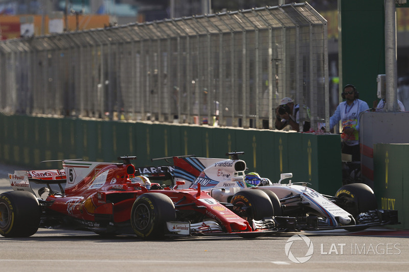 Sebastian Vettel, Ferrari SF70H, battles, Felipe Massa, Williams FW40, at the restart