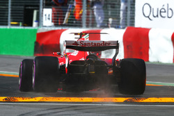 Kimi Raikkonen, Ferrari SF70H jumps the kerb