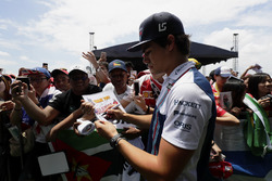 Lance Stroll, Williams, signs autographs for fans