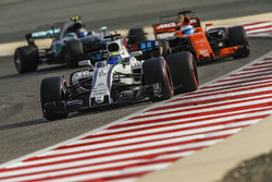 Felipe Massa, Williams FW40, leads Fernando Alonso, McLaren MCL32, and Valtteri Bottas, Mercedes AMG