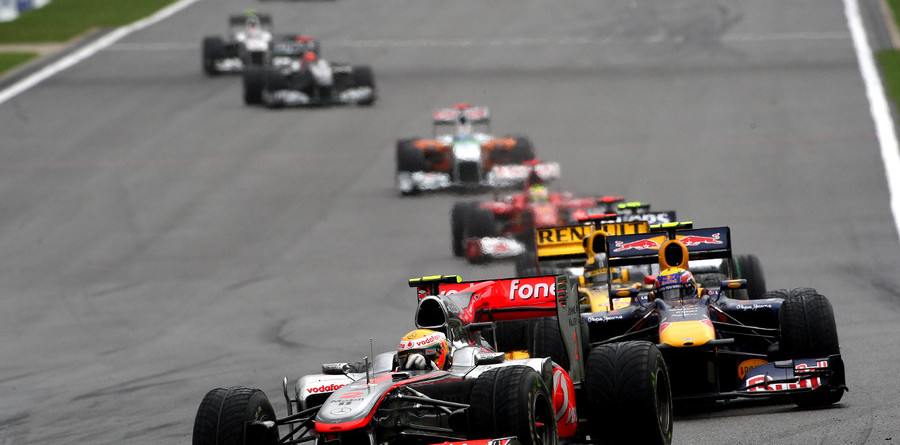 Hamilton cruises to victory at slippery Spa