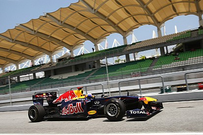 Vettel extends lead with Sepang win