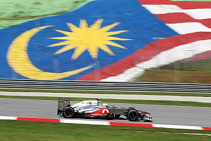 Hamilton turns hot laps to snatch Malaysian GP pole in Sepang
