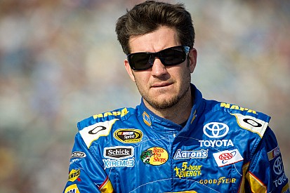 Truex Jr. discusses with the media racing at Kansas