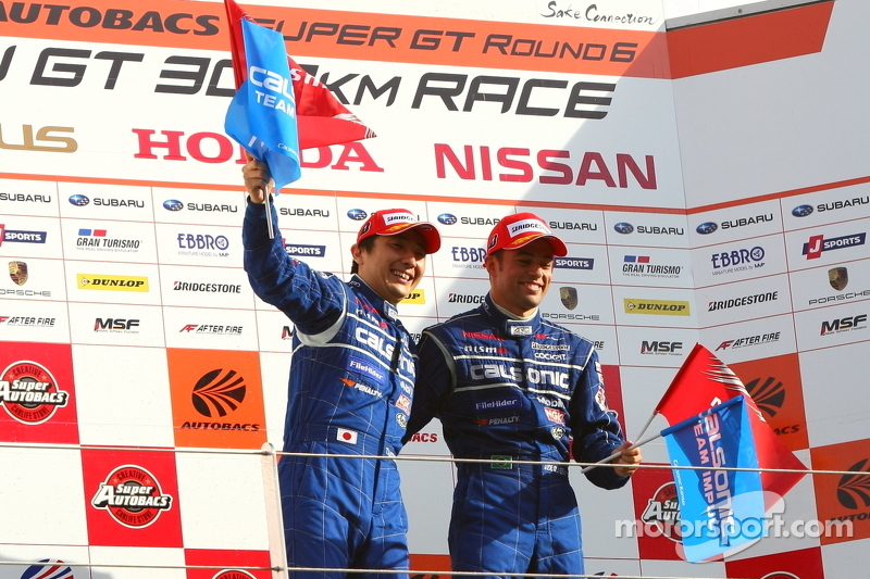 Race winners Joao Paulo de Oliveira and Tsugio Matsuda celebrate