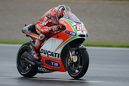 Third and fifth best times for Hayden and Rossi on wet Valencia track