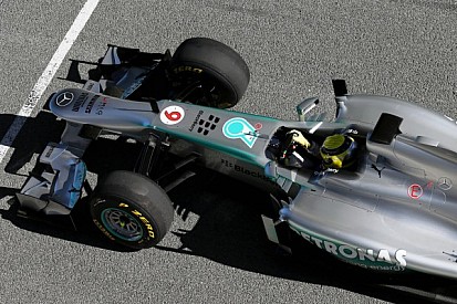 Hamilton watches Rosberg debut 2013 car