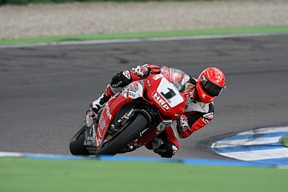 Schumacher back at speed on two wheels