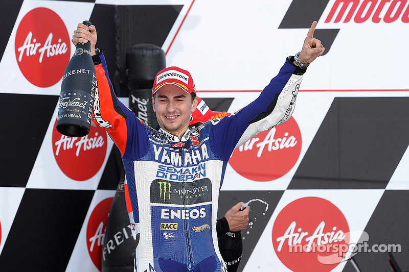 Lorenzo keeps championship hopes alive with victory in Japan