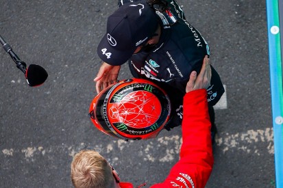 Hamilton presented with Schumacher F1 helmet after record-equalling win