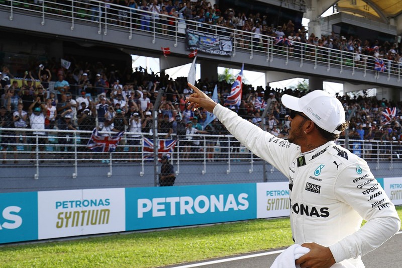 Lewis Hamilton takes Malaysian GP pole, Sebastian Vettel at the back
